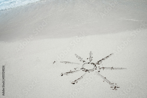 beautiful drawing on the sand near the sea shore background