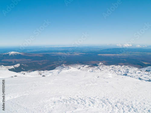 Wide view across central North Island with snowy foreground