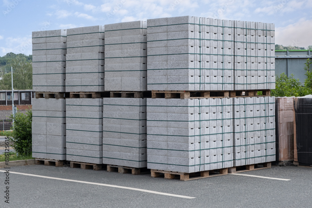 Concrete Cinder Blocks in Industrial Pallets, Grey brick Shapes building material. New for use on construction site or store in europe