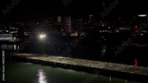 Arriving at Penang cruise terminal early in the dark, overlooking the pier, city lights and lighthouse, Malaysia, George Town photo