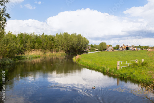 The river - Barneveldse beek, flows quietly through the agricultural landscape. photo