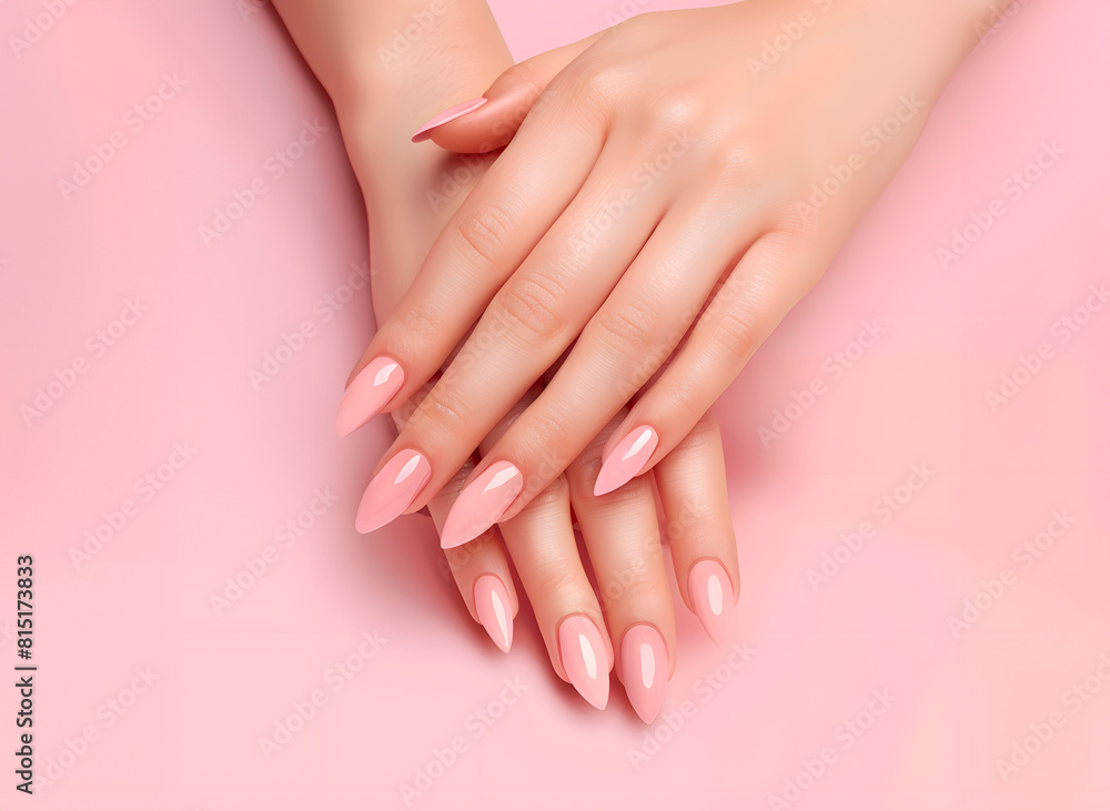 Woman hands with a very beautilul manicure on a light pink background