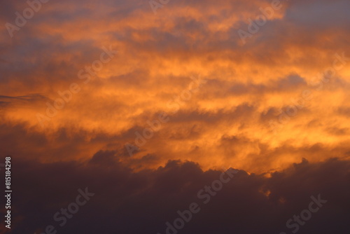 a sunset with clouds and a sunset in the background