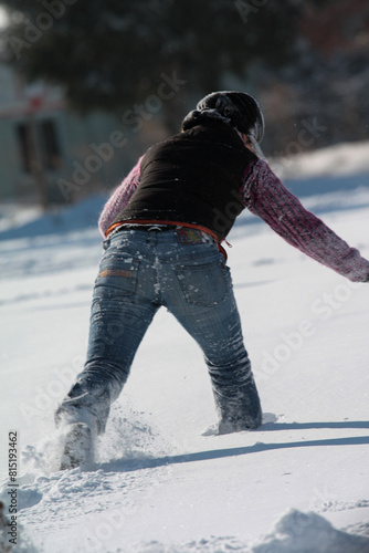 Standing on a snowy slope, enjoying winter sport in freezing weather