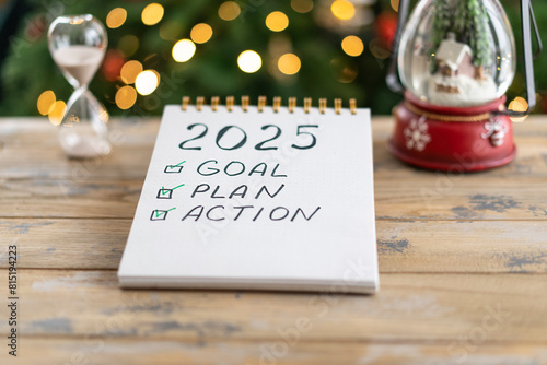 Notepad with plans for the next year and the inscription - 2025 goal, plan, action