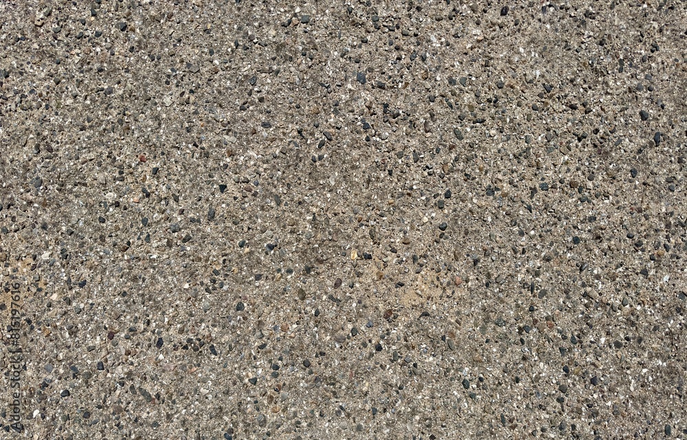 An aerial view captures a sandy and gravelly roadway, showcasing textures like grains, pebbles, and tracks, embodying ruggedness and connectivity. An aerial view captures a sandy and gravelly roadway, showcasing textures like grains, pebbles, and tracks, embodying ruggedness and connectivity.