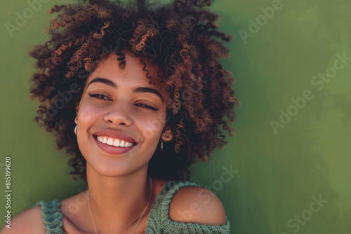 Happy woman with a good style against Green background. © NoOneSaid