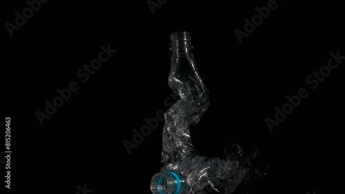 Recycling troubles with bottles waste. A view of used plastic bottles on the black background. A concept of recycling plastic trash movement of Earth. photo