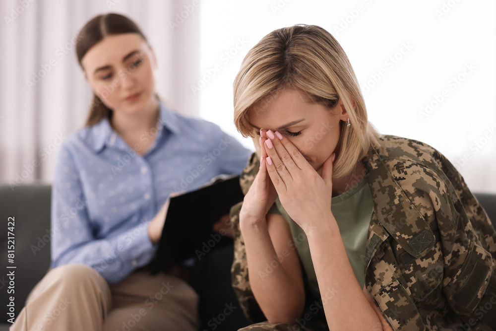 Psychotherapist working with military woman in office Psychotherapist working with military woman in office