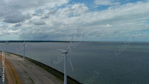 Aerial view of clean power generating wind turbines. photo