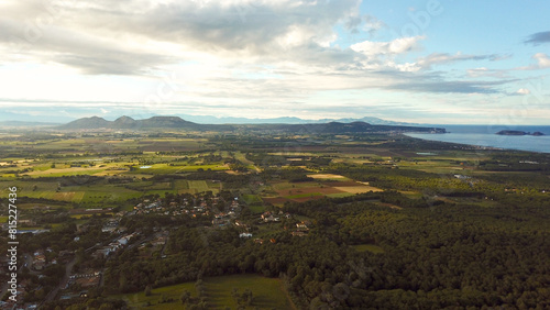 aerial view of the countryside between Els Masos de Pals Torroella de Montgrí and L’Estartit at the Mediterranean Sea, the Pyrenees at the horizon, evening light, Spain photo