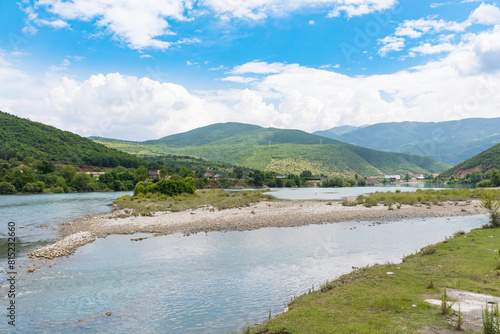 The Valbona river flows into lake Kamoni in Albania photo