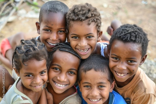 Portrait of a group of African children smiling at the camera. © Igor