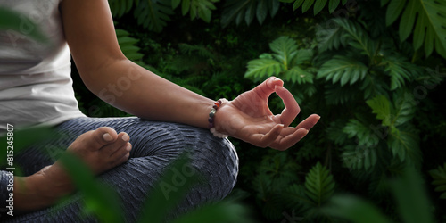 Woman in meditation position in nature