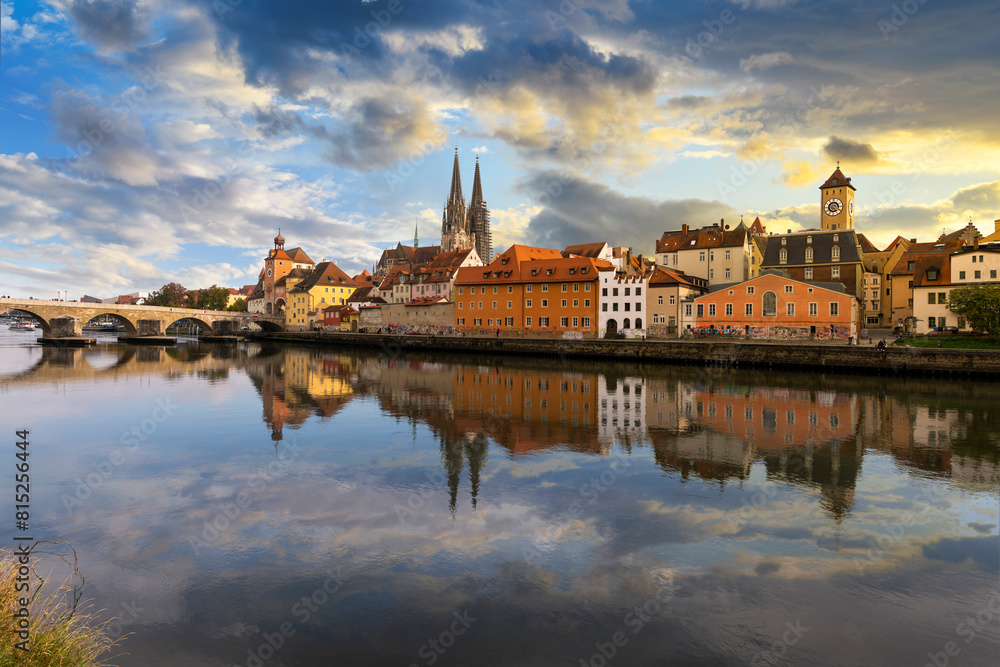 A dramatic sky with storm clouds at dusk over the skyline of the medieval old town district, the Danube River, Saint Peter's Church and Regensburg Town Hall in the Bavarian city of Regensburg, Germany A dramatic sky with storm clouds at dusk over the skyline of the medieval old town district, the Danube River, Saint Peter's Church and Regensburg Town Hall in the Bavarian city of Regensburg, Germany