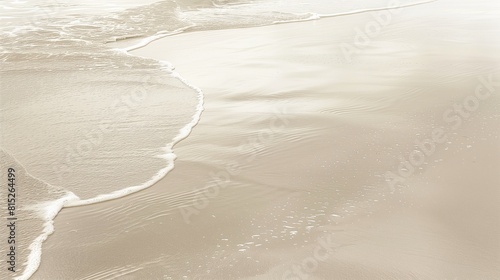 beige sand and water, gentle waves in the background, muted colors