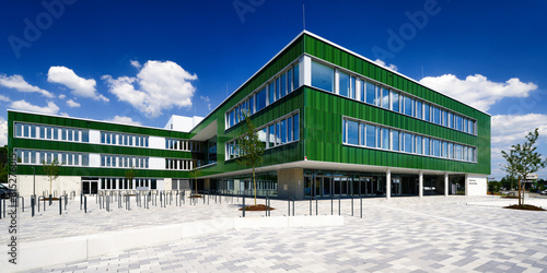 almost completed new building of a comprehensive school in cologne's Vogelsang district in sunny weather