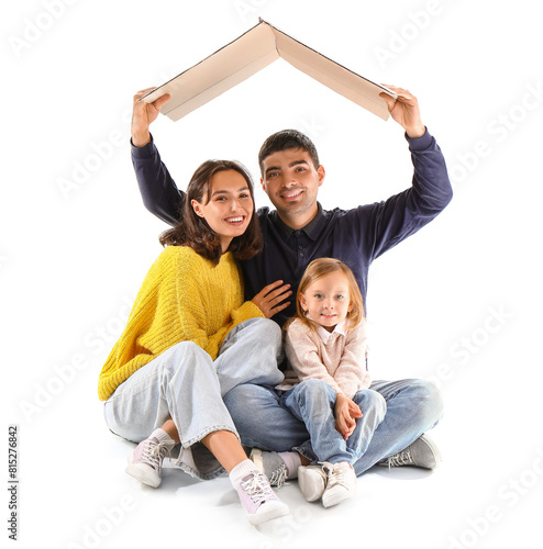 Happy family with cardboard in shape of roof dreaming about their new house on white background © Pixel-Shot