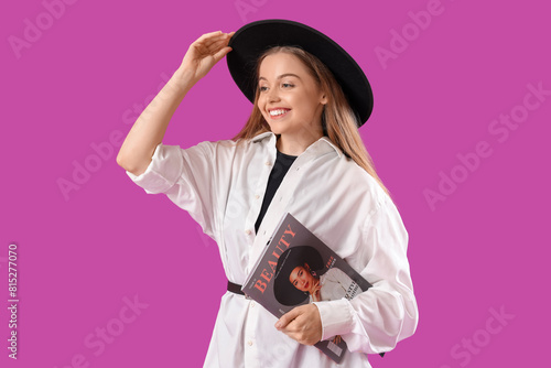 Smiling young woman in blac...