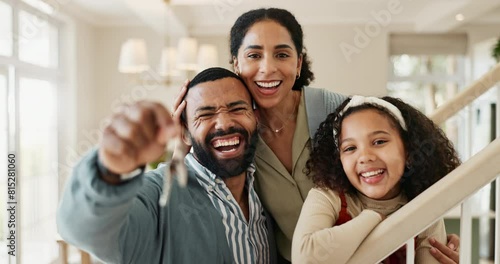 Happy family, keys and hug with love for new home, real estate or investment together on staircase. Portrait of father, mother and young daughter with smile for access to house or moving in on stairs photo
