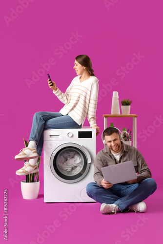 Young couple with laptop an...