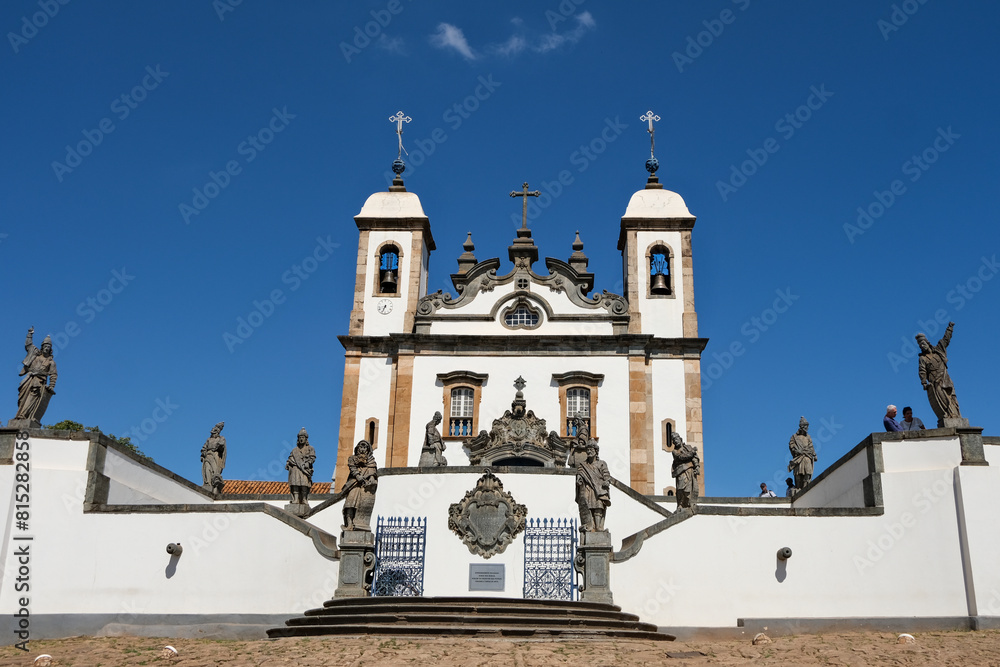 Fototapeta premium Congonhas, Brazil - May 2, 2024: The Sanctuary of Bom Jesus de Matosinhos, adorned with sculptures by Antônio Francisco Lisboa, the Aleijadinho, work known as 12 Prophets