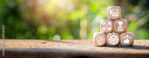 Workshop concept, Wooden block on desk with teacher, idea, objectives, motivation, teamwork and development icon on virtual screen.
