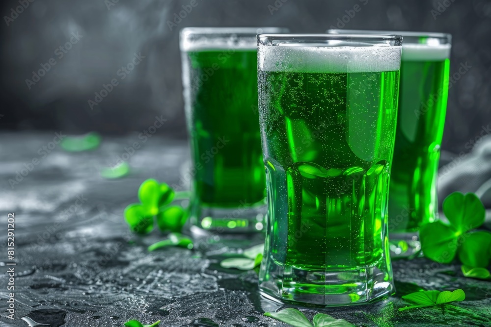 Glass of green beer on a textured dark gray table. Clover. St. Patrick's Day concept Glass of green beer on a textured dark gray table. Clover. St. Patrick's Day concept