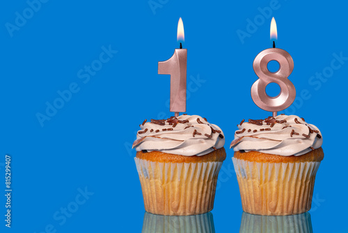 Birthday Cupcakes With Candles Lit Forming The Number 18.