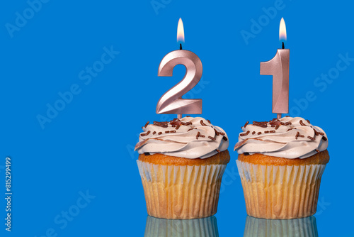 Birthday Cupcakes With Candles Lit Forming The Number 21.