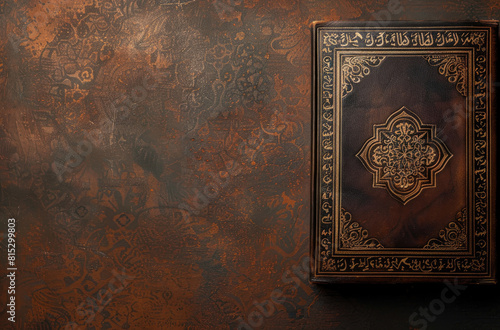 Ornate book with intricate Arabic calligraphy on textured background