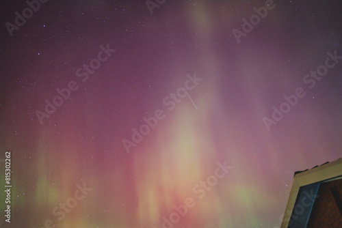 aurora australis or southern lights visible from Tasmania's clear night sky full of stars and constellations, shot in May 2024