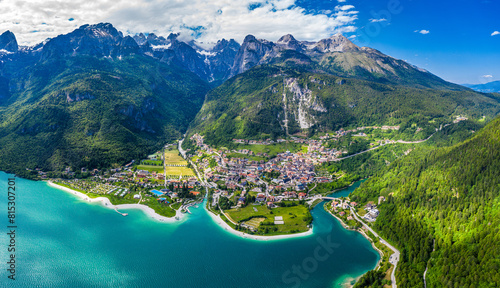 Drone Panoramic View of Molveno Lake Surrounded by Italian Alps and Lush Greenery