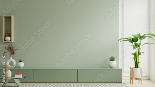 Minimalist living room interior have green cabinet for TV and decor accessories with green color wall- 3D rendering photo