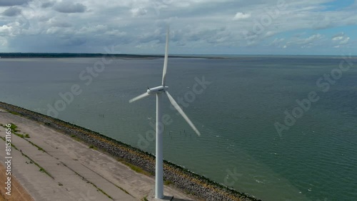 Aerial view of clean power generating wind turbines. photo