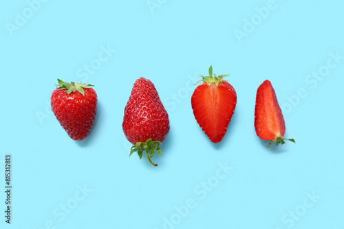Sweet fresh strawberries on blue background © Pixel-Shot