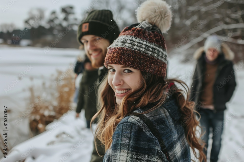 Young couple walking in the park in winter. Happy people having fun outdoors. Young couple walking in the park in winter. Happy people having fun outdoors.