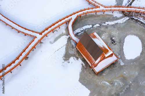 Aerial photo of the snow scene of residential houses in the Qilian Weihai Scenic Area in Jiuquan, Gansu Province, China photo