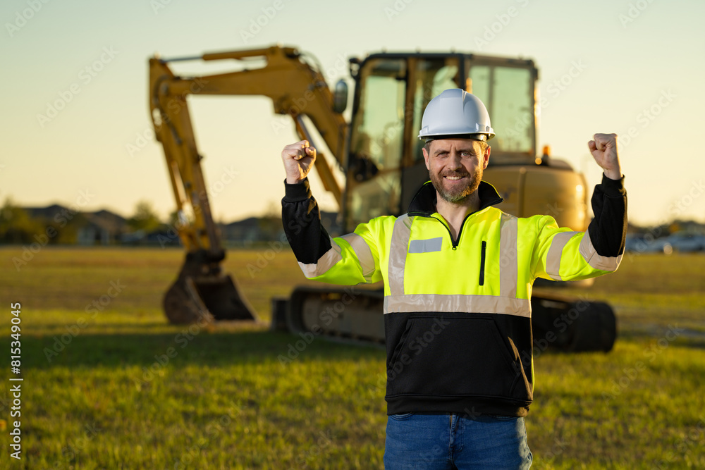 Builder in helmet on the construction site. Builder in helmet on the construction site.