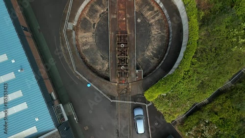 Aerial of a vintage railway station in Whitehead, Northern Ireland.

The camera moves backwards showing a train turntable.

Produced in 4K, 60 frames per second and Rec709 color space. photo