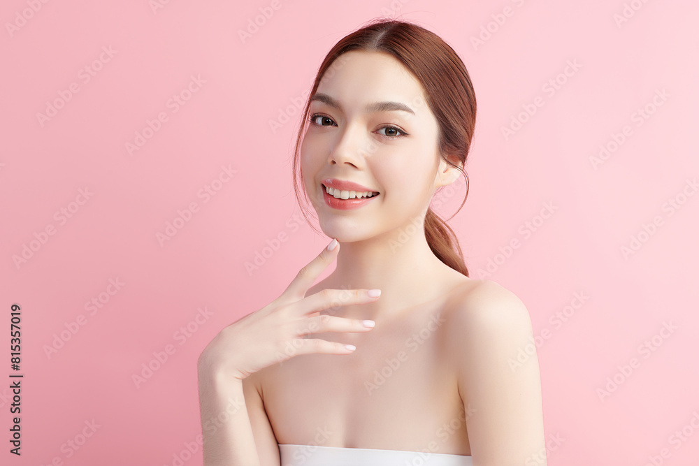 Naklejka premium Beautiful young asian woman with clean fresh skin on pink background, Face care, Facial treatment, Cosmetology, beauty and spa, Asian women portrait.