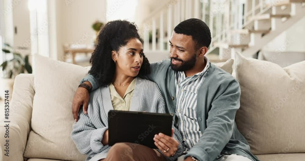 Happy couple, relax and browsing with tablet on sofa for interior design, planning or discussion at home. Man and woman talking with smile on technology for scrolling or reading news in living room Happy couple, relax and browsing with tablet on sofa for interior design, planning or discussion at home. Man and woman talking with smile on technology for scrolling or reading news in living room