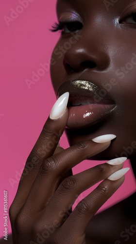 Photo of woman hand with manicure in beautiful fashion white colors. Pretty elegant acrylic gel polish stiletto nail manicure wear armor long nails face pose for spa salon web advertising branding
