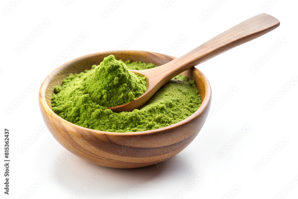Wooden spoon with powdered matcha green tea in bowl Wooden spoon with powdered matcha green tea in bowl