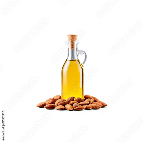 Almond oil in a clear glass bottle with a scattered handful of almonds on a