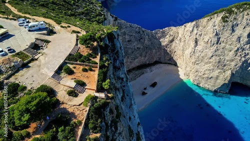 AERIAL People at the viewpoint of the Navagio Beach, in sunny Zakynthos, Greece photo