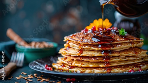   Syrup-drenched pancake tower on a syrup-coated plate
