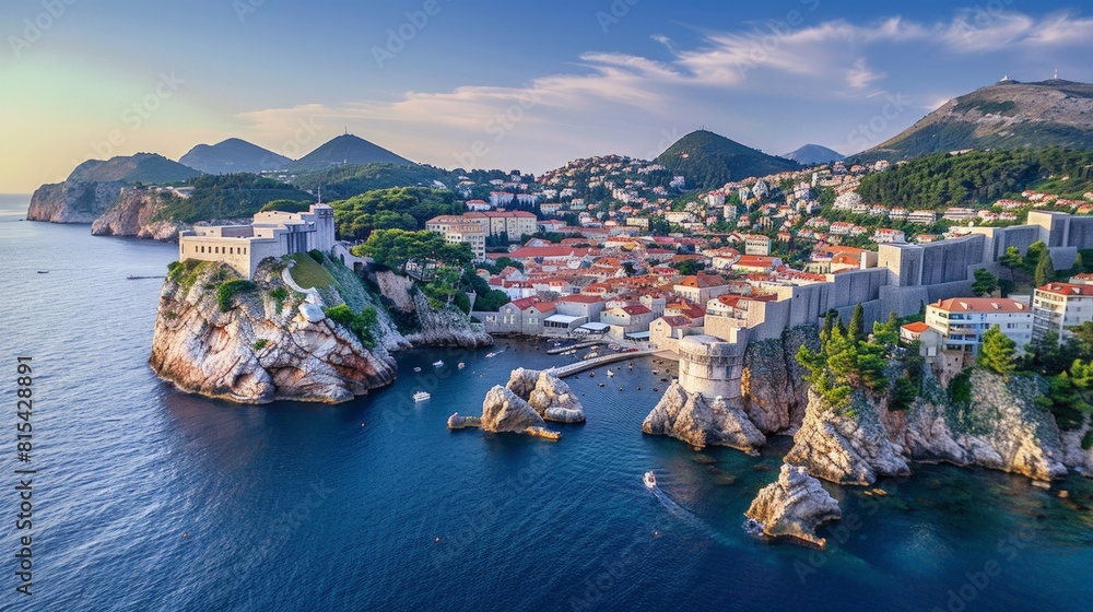 Aerial view of Dubrovnik in Croatia, with its well-preserved medieval walls and red-roofed buildings along the Adriatic Sea.     