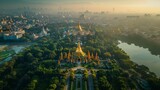 Aerial view of the Shwedagon Pagoda in Yangon, Myanmar, with its golden stupa shining brightly amid the bustling city and lush green parks.     