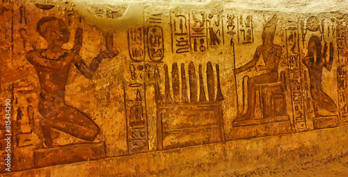 Wall relief depicting Ramesses II making offerings to himself as a God at the rock cut Great Temple of  Abu Simbel built by Ramesses II in Nubia,Egypt